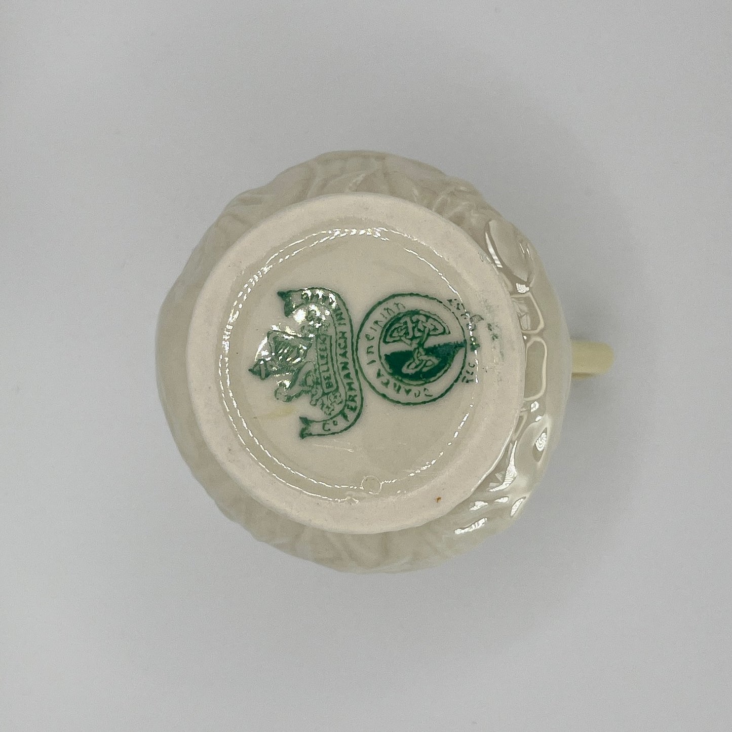Belleek Cream Pitcher – Irish Parian Porcelain with Embossed Florals & Yellow Handle (6th Mark, 1965–1980)