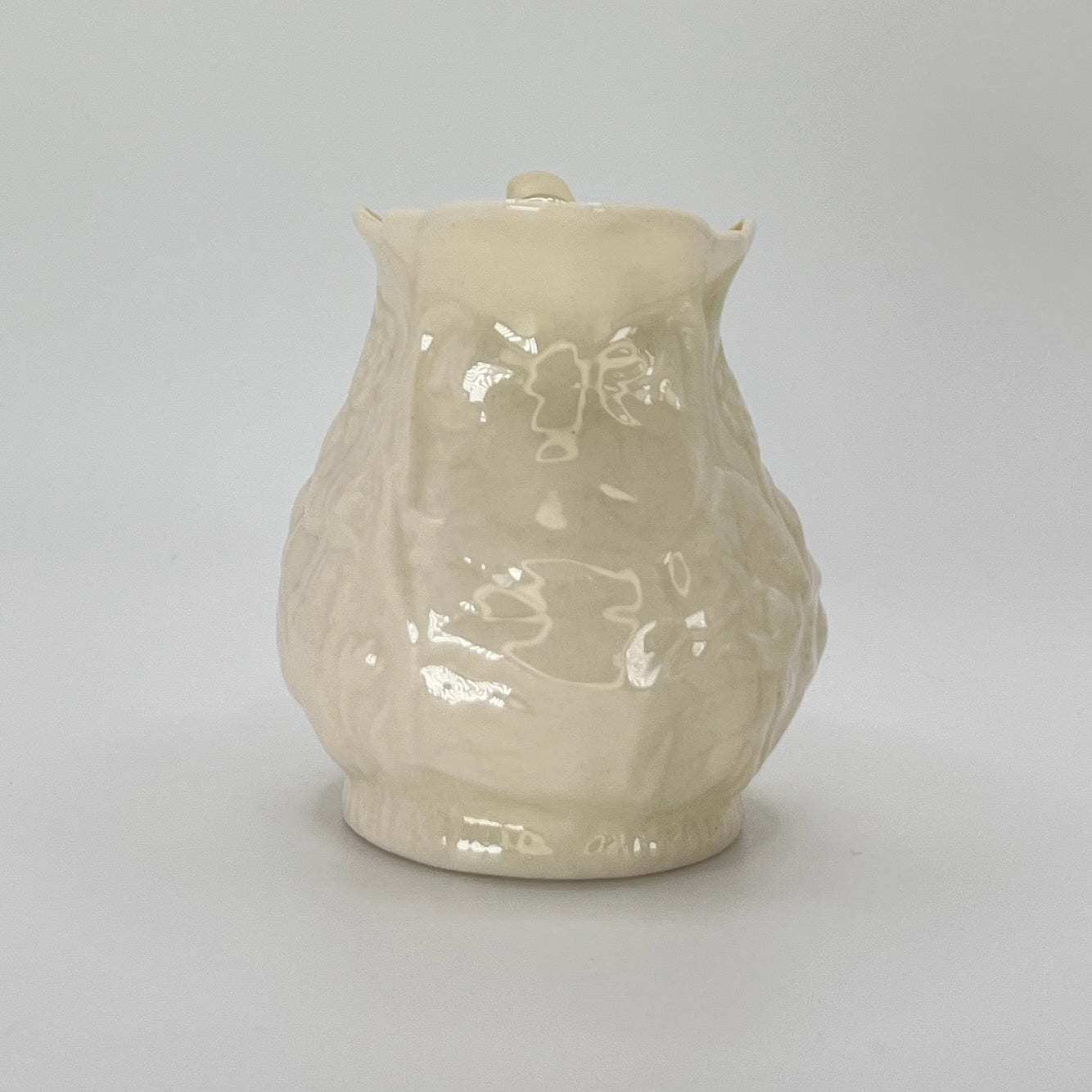 Belleek Cream Pitcher – Irish Parian Porcelain with Embossed Florals & Yellow Handle (6th Mark, 1965–1980)