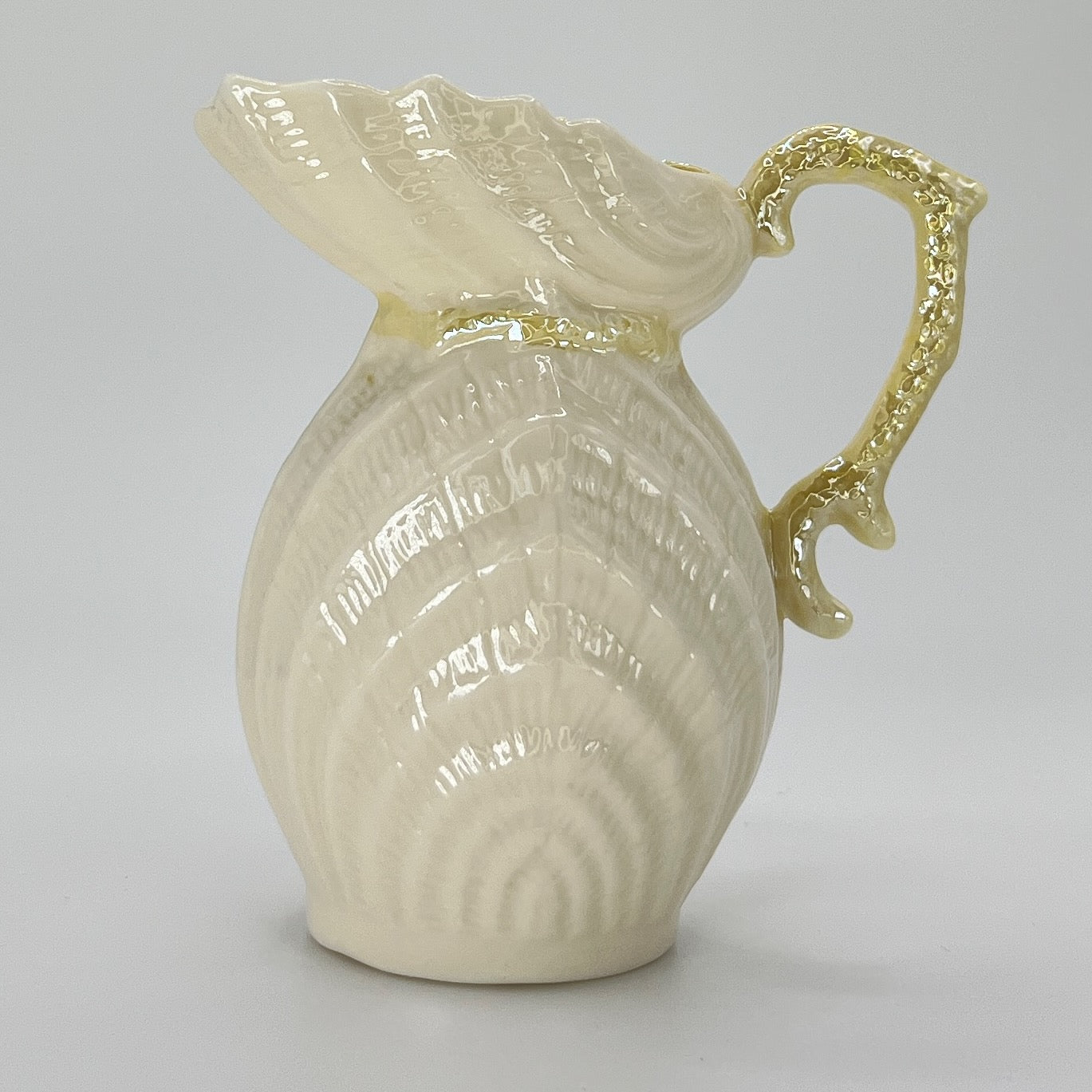 Belleek Shell Ewer Pitcher – Irish Parian Porcelain with Yellow Handle (6th Mark, 1965–1980)