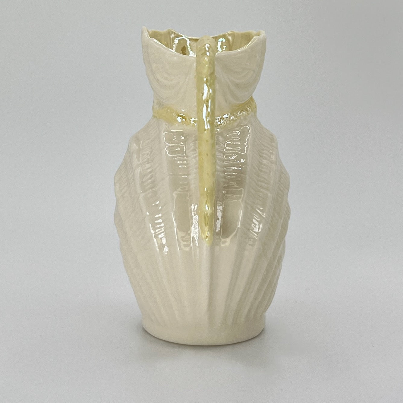 Belleek Shell Ewer Pitcher – Irish Parian Porcelain with Yellow Handle (6th Mark, 1965–1980)