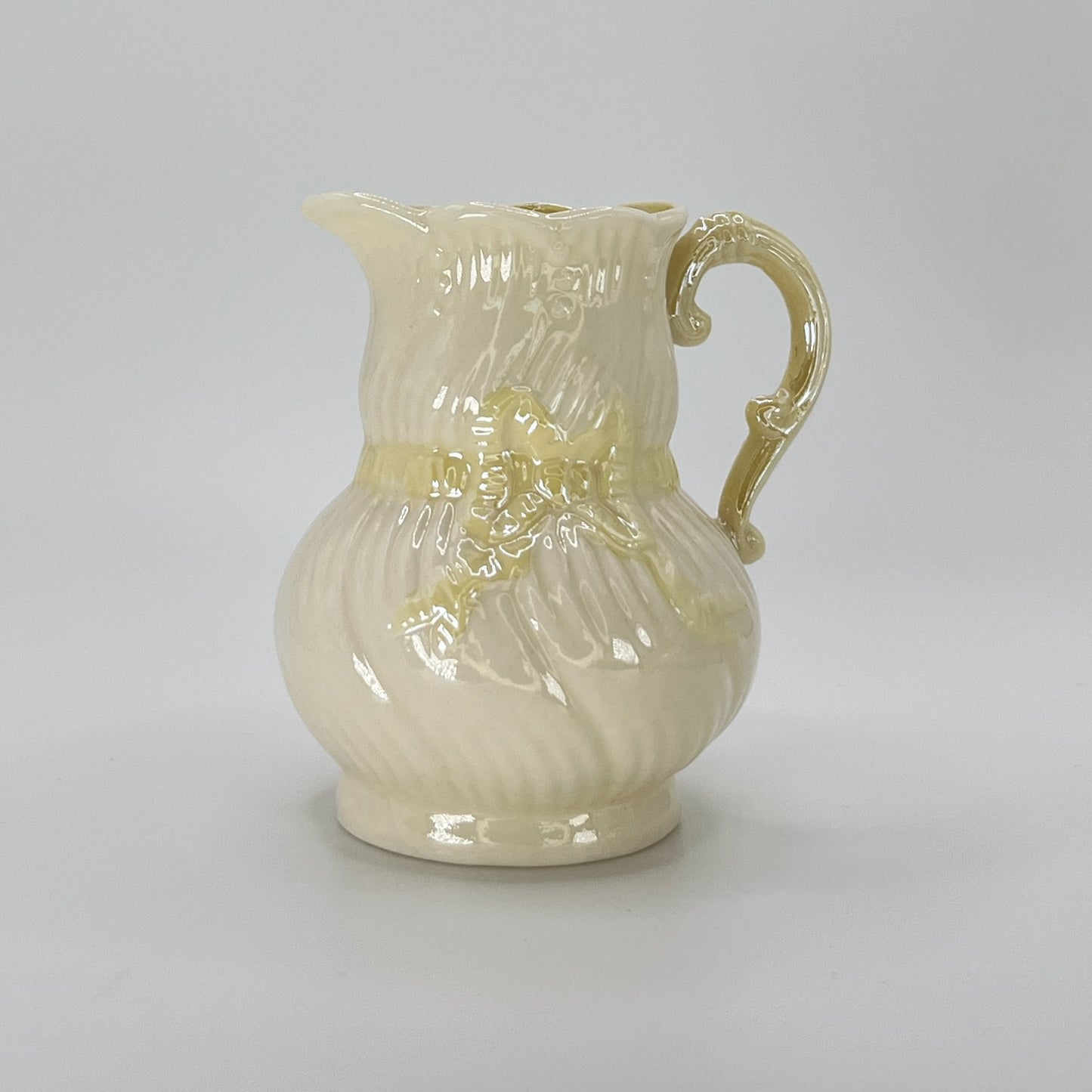 Belleek Cream Pitcher with Embossed Bow & Gold Handle – Ireland, 6th Mark (1965–1980)