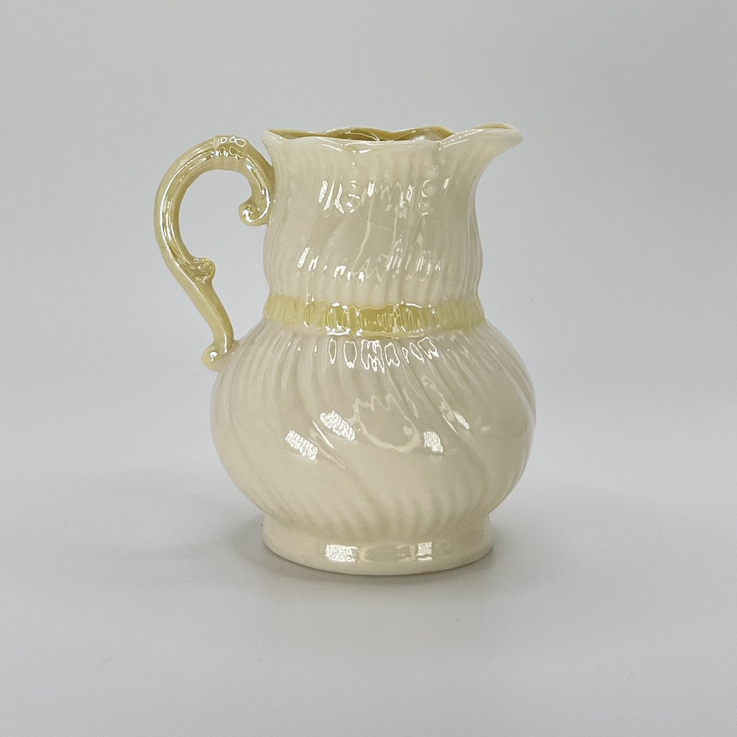 Belleek Cream Pitcher with Embossed Bow & Gold Handle – Ireland, 6th Mark (1965–1980)