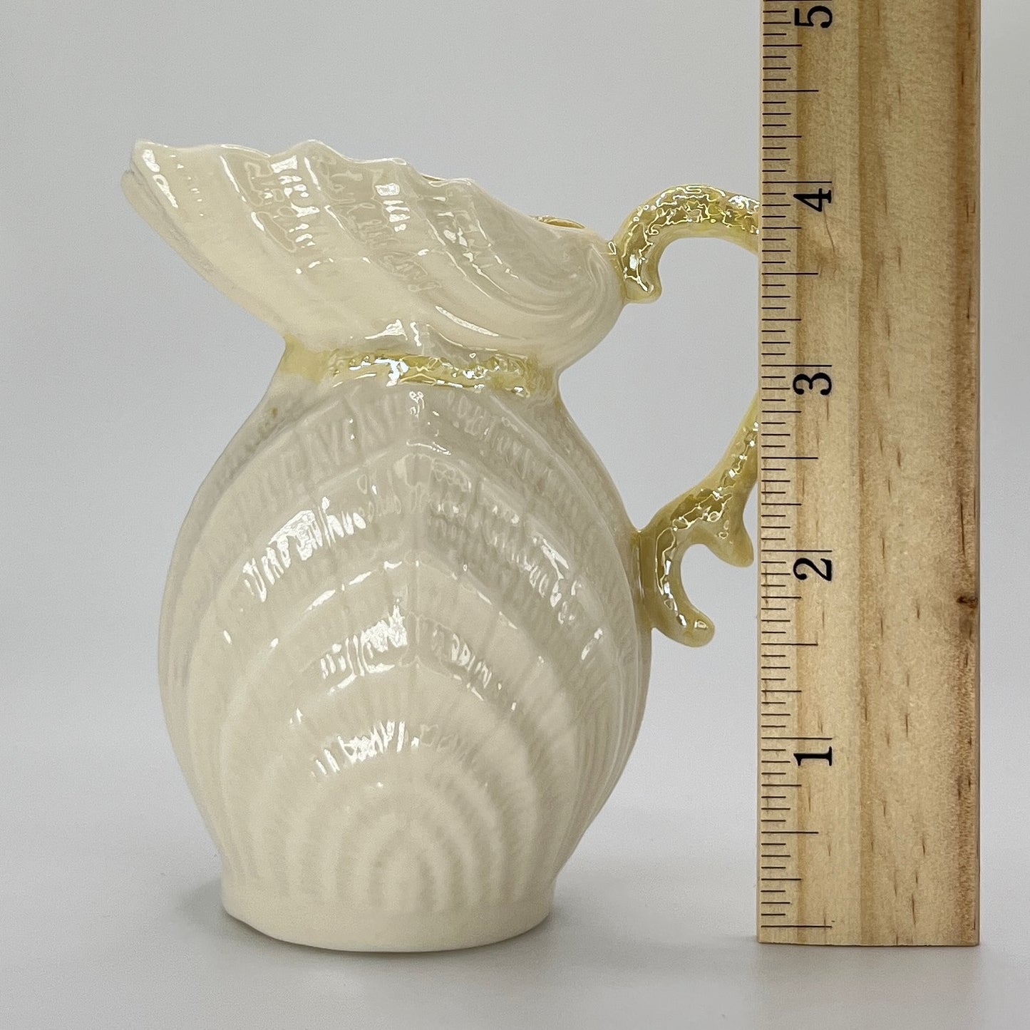 Belleek Shell Ewer Pitcher – Irish Parian Porcelain with Yellow Handle (6th Mark, 1965–1980)