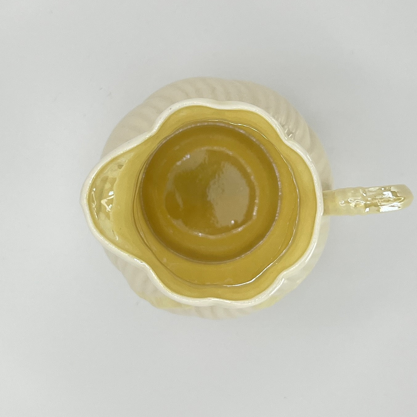 Belleek Cream Pitcher with Embossed Bow & Gold Handle – Ireland, 6th Mark (1965–1980)
